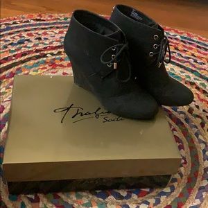 Black wedge booties with gold accent